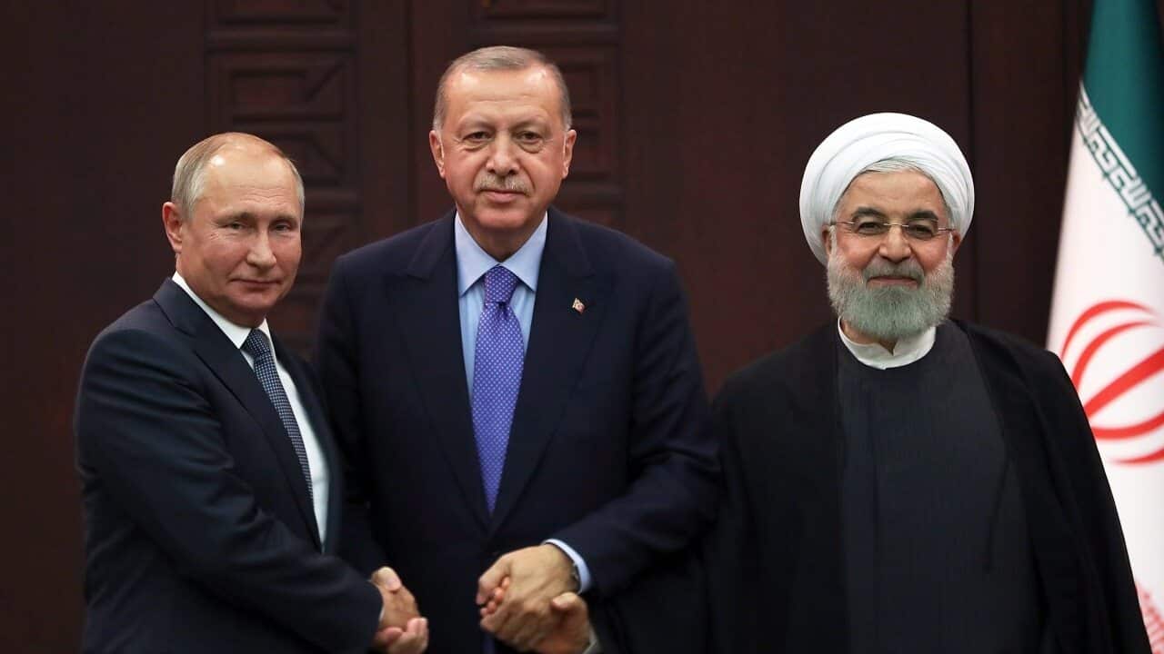 Turkish President Recep Tayyip Erdogan (C), Russian President Vladimir Putin (L) and Iranian President Hassan Rouhani (R) meet on Monday.