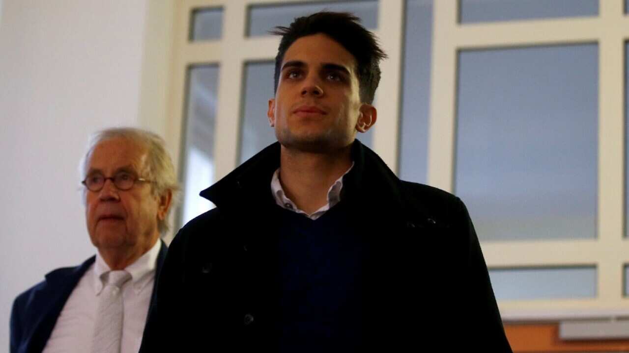 Borussia Dortmund's Marc Bartra arrives to testify in a trial in Dortmund
