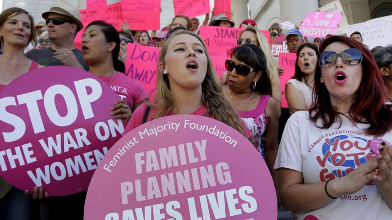 Planned Parenthood supporters rally in Los Angeles