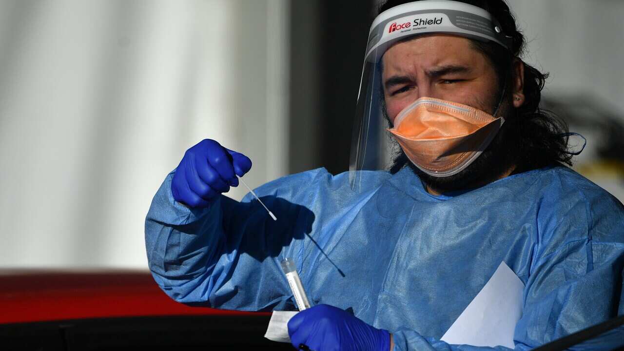 Members of the public are tested at a pop up COVID clinic at Roselands shopping centre in Sydney, Friday, July 30, 2021. The stay-at-home orders for coronavirus-hit Greater Sydney and surrounds have been tightened with non-essential retail to close and al