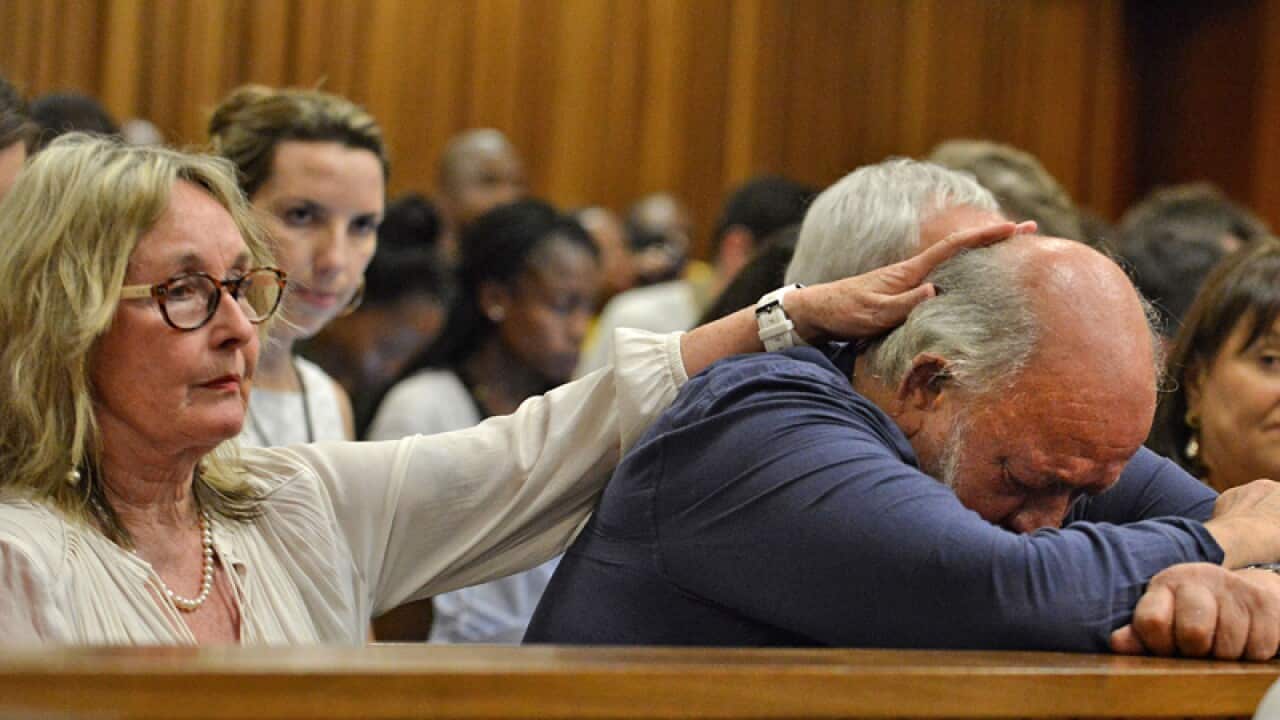 Reeva Steenkamp's father Barry Steenkamp (r) and his wife June.