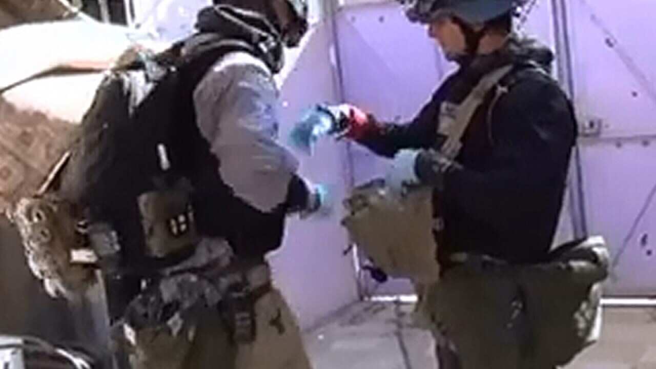 UN inspectors at a site that was hit by a chemical gas weapon