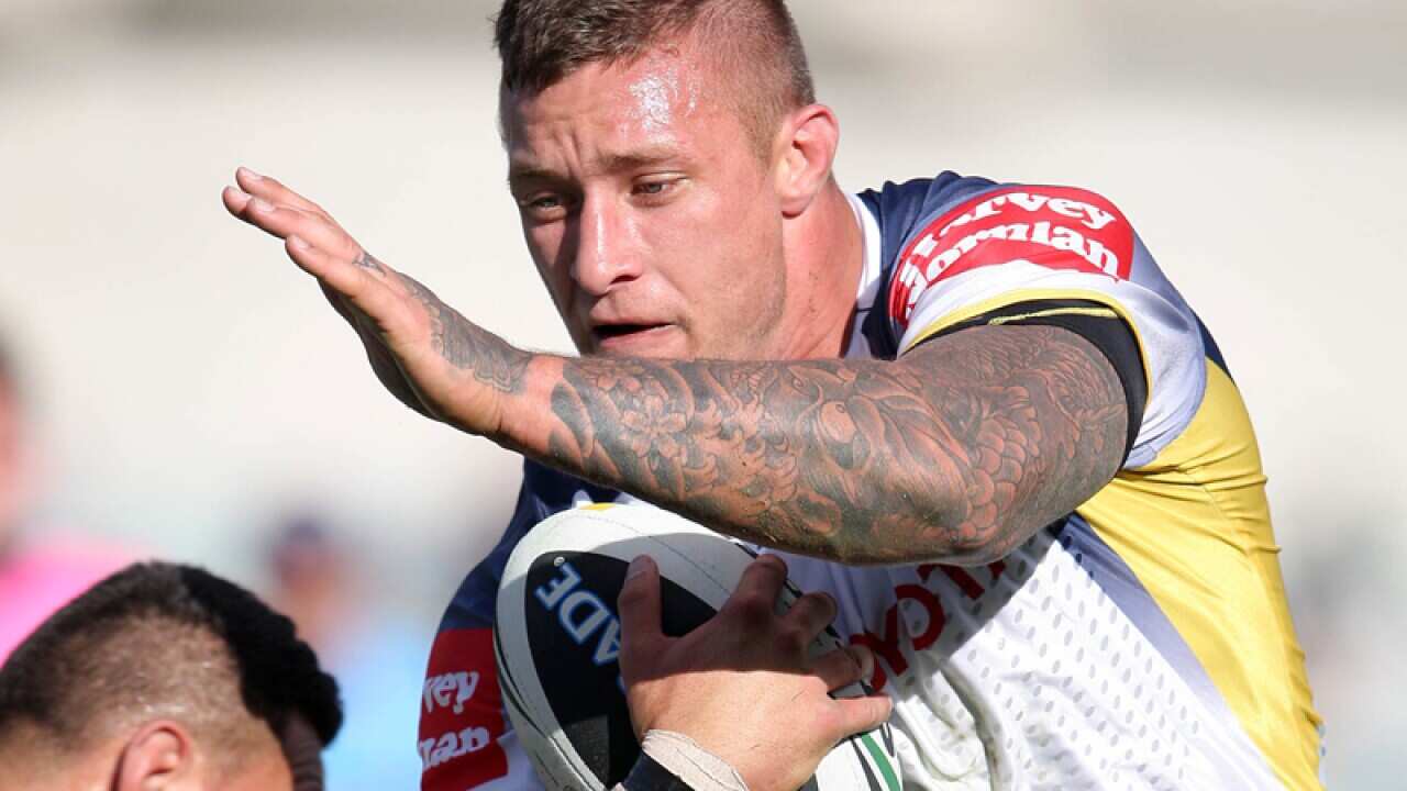 Tariq Sims runs with the ball.