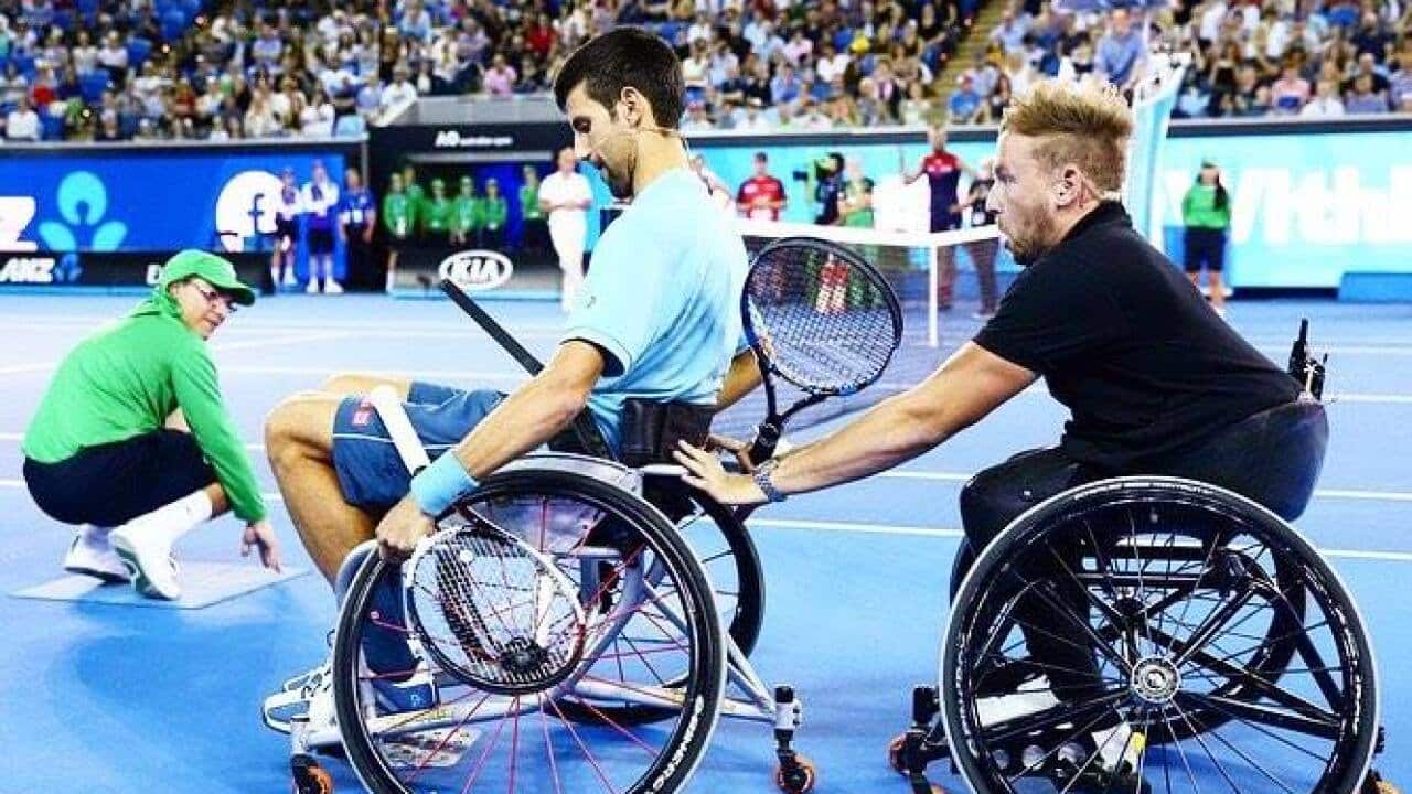 Dylan Alcott and Novak Djokovic on the tennis court in Melbourne