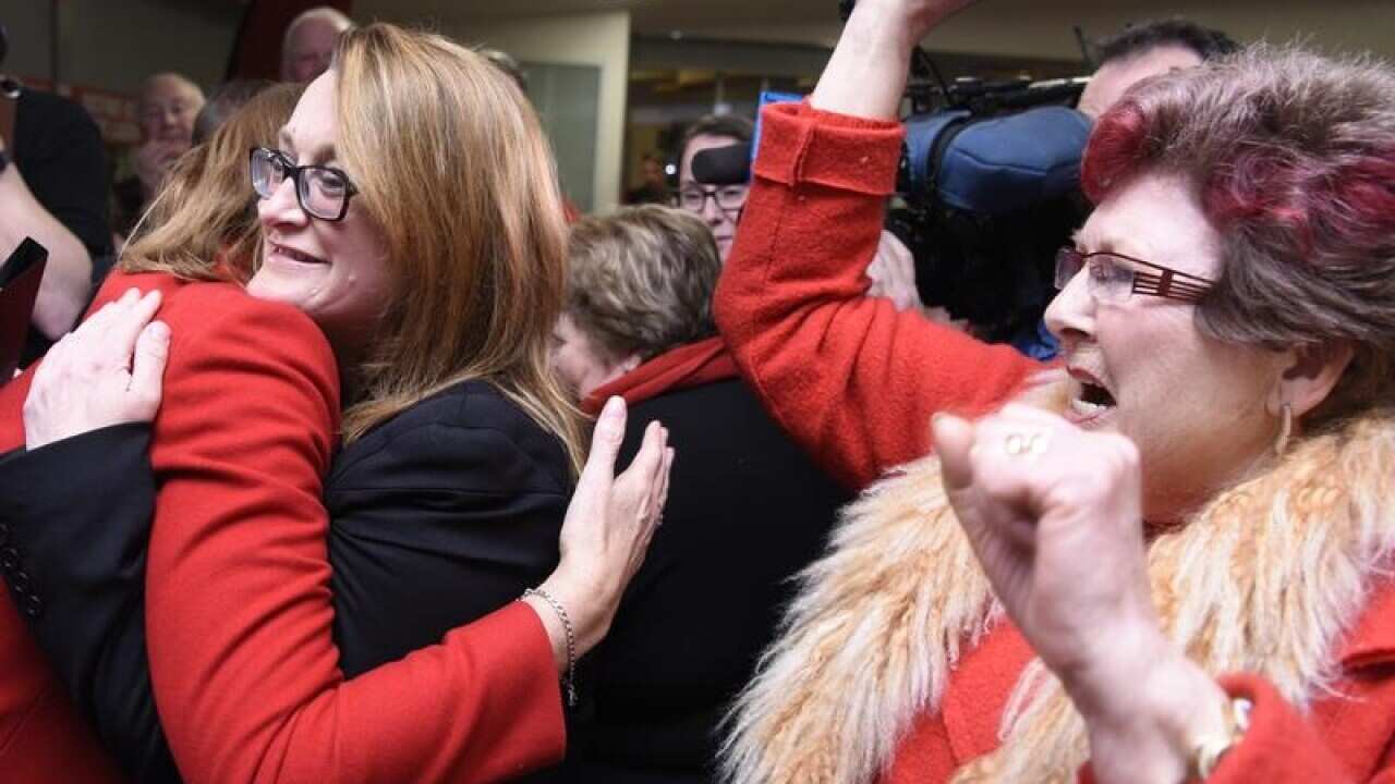 Justine Keay celebrates her by-election win with supporters.