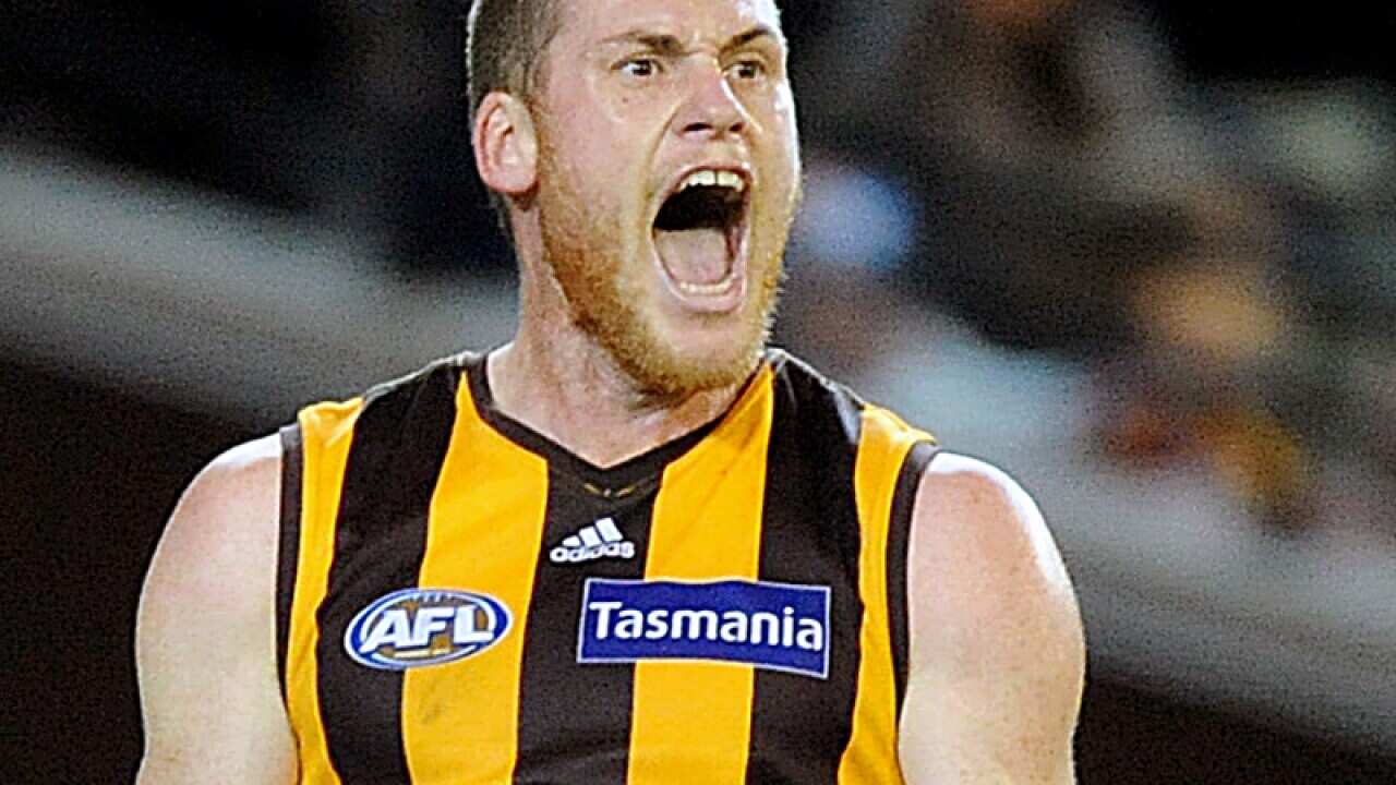 Jarryd Roughead of Hawthorn celebrates after kicking a goal