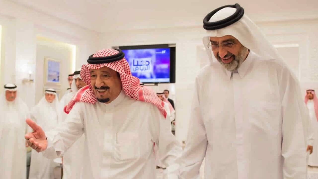 Saudi King Salman, left, walks with Qatari Sheikh Abdullah bin Ali Al Thani, right, at the monarch's vacation home in Tangiers, Morocco.