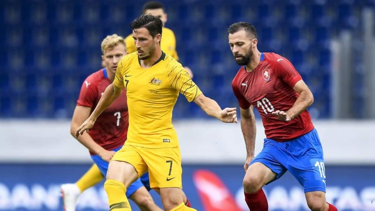 Mathew Leckie (C) of Australia in action against the Czech Republic.
