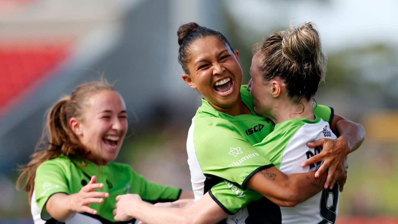 Former A-League Women's player, Allira Toby celebrates with her teammates during a football game in 2022.
