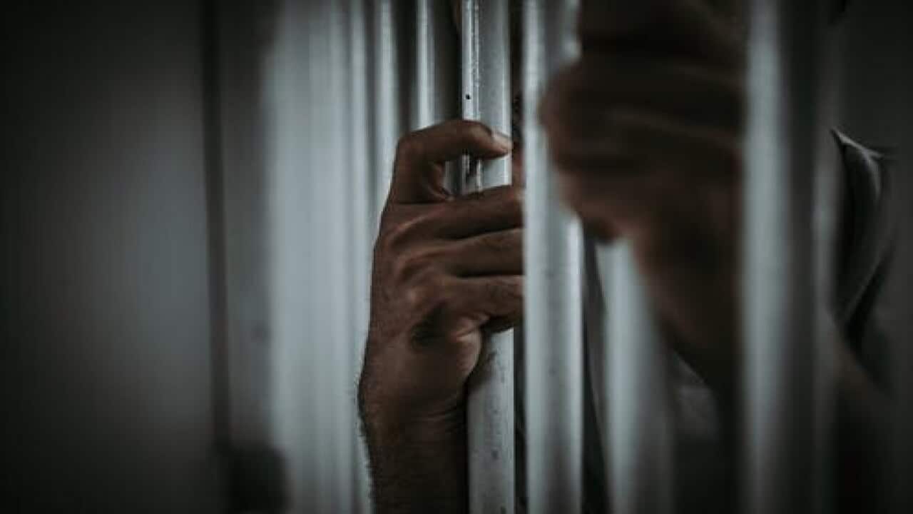 Man behind prison bars