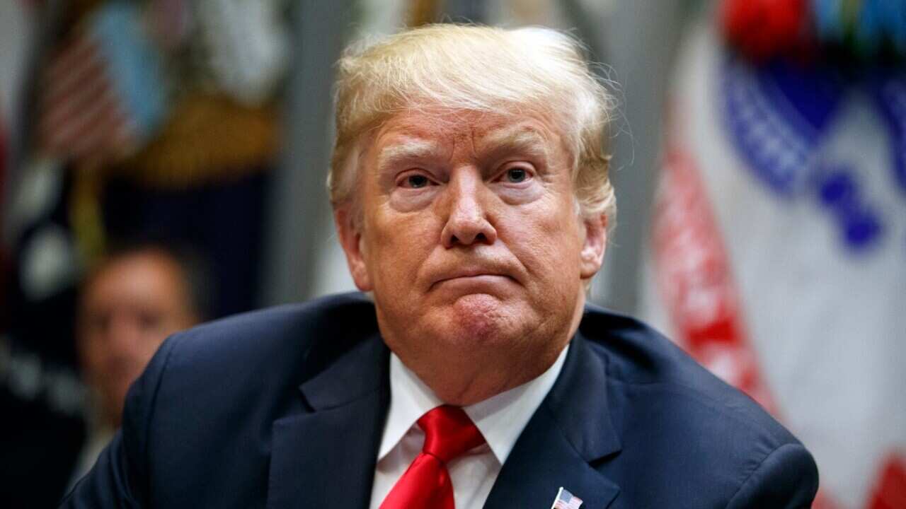 President Donald Trump listens to a question from a reporter during a meeting of the President's National Council of the American Worker on Sept 17