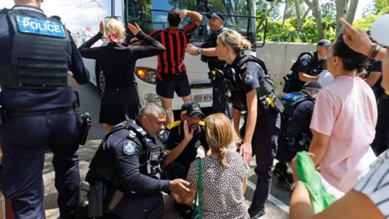 Protesters tried to block a bus carrying Irannian playes as they left a Gold Coast hotel for the airport on Tuesday.jpg