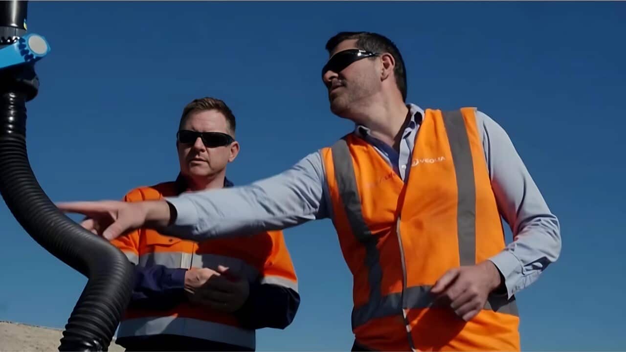 Richard Kirkland (L) and Professor P J Cullen checking a methane well (Reuters).jpg