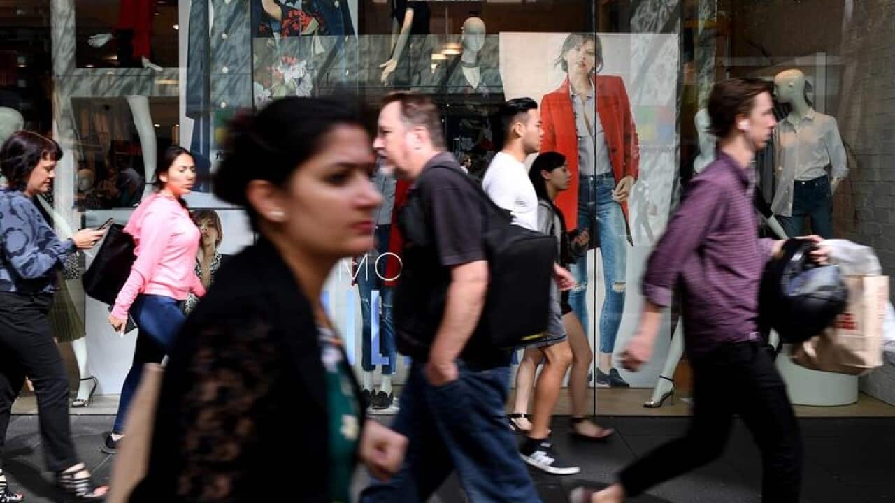 People are seen at Pitt Street mall in Sydney.