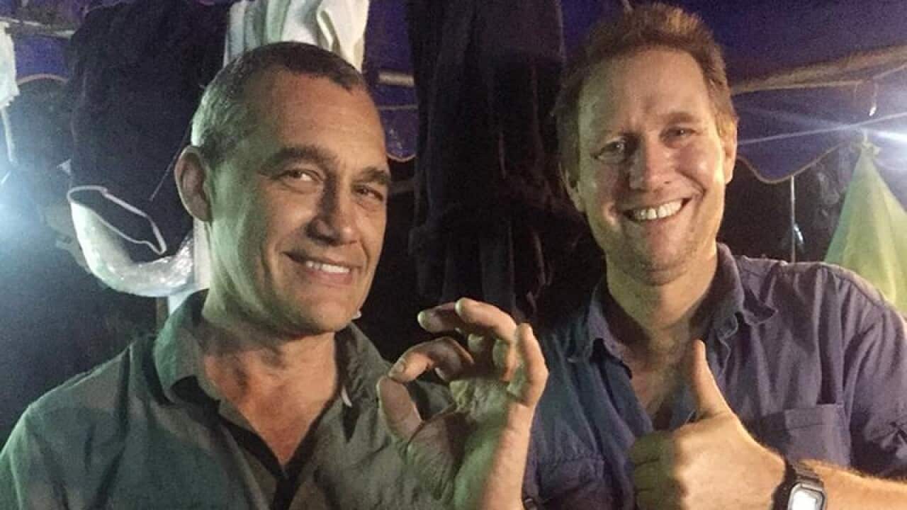 Australian divers Craig Challen and Richard Harris have returned home after the Thai rescue.