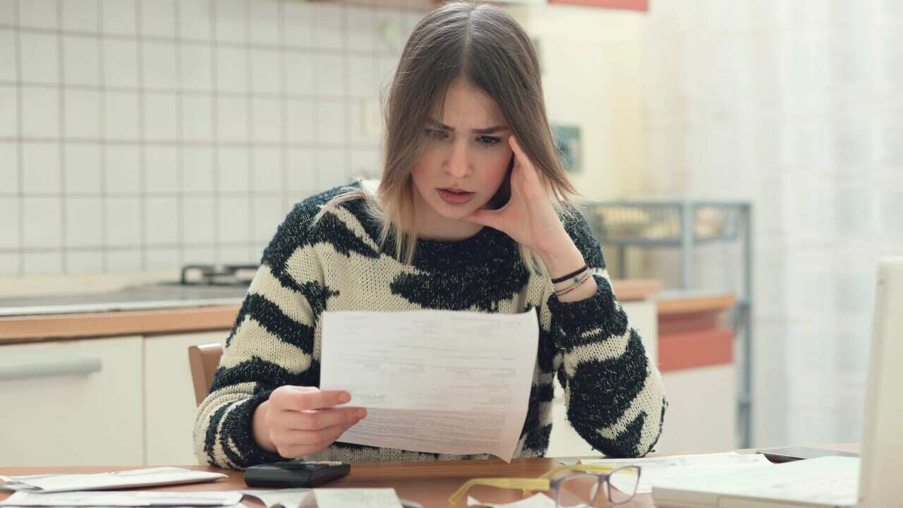 Concerned woman with bills