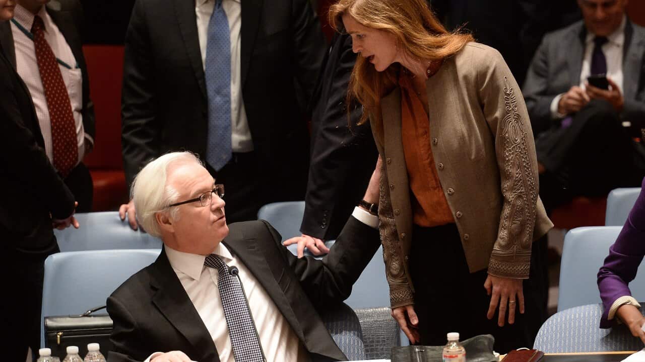 US Ambassador to the UN Samantha Power talks with her Russian counterpart Vitaly Churkin