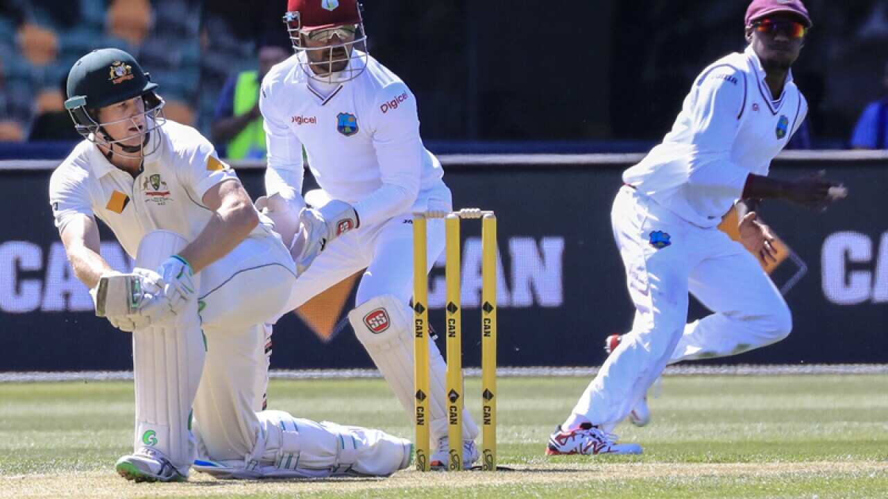 Australian batsman Adam Voges plays a sweep shot