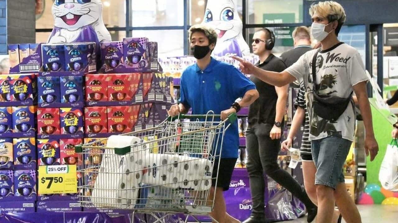 Shoppers are seen exiting a grocery store in Brisbane.