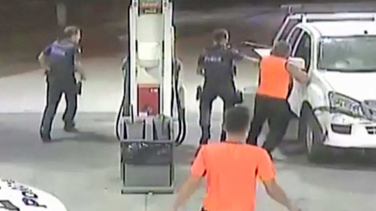 Police and the truck driver attempting to stop the offender
