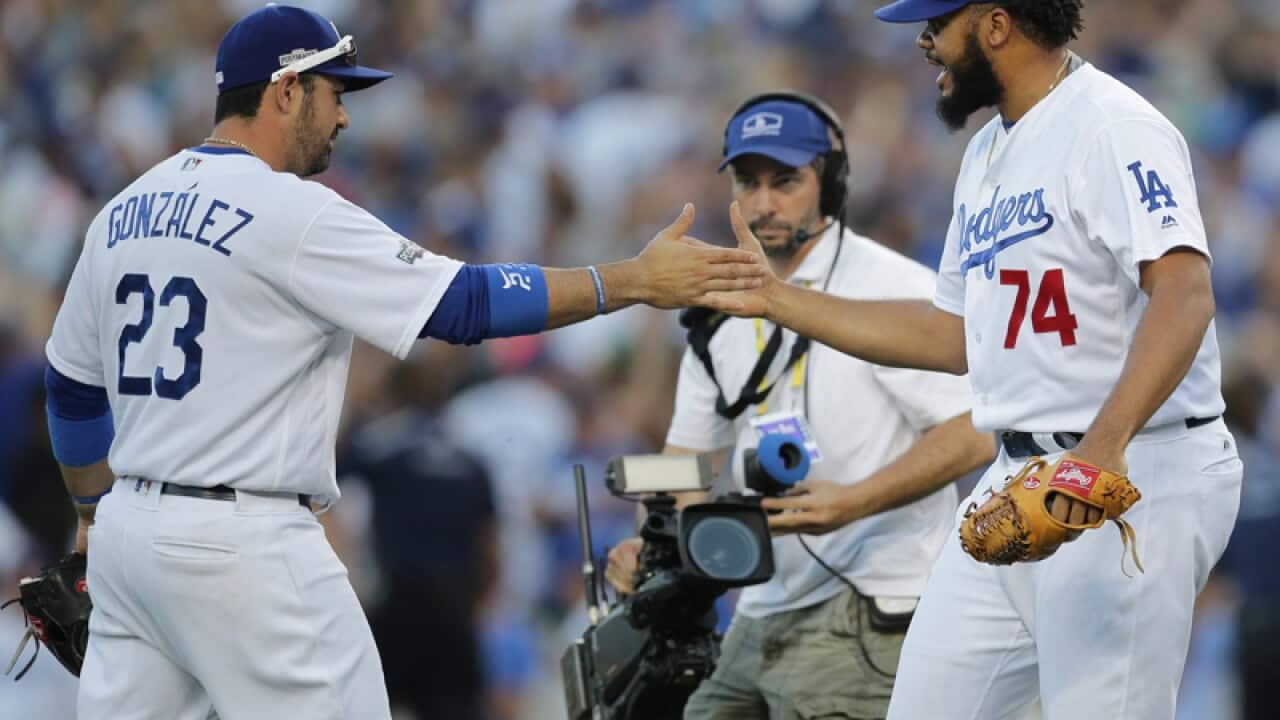 Los Angeles Dodgers Kenley Jansen (R) is and Adrian Gonzalez