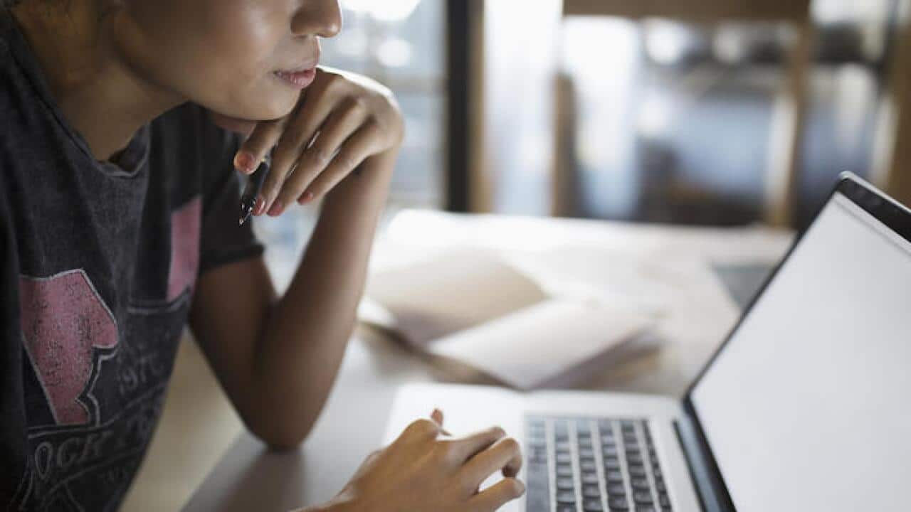 Young woman working at laptop