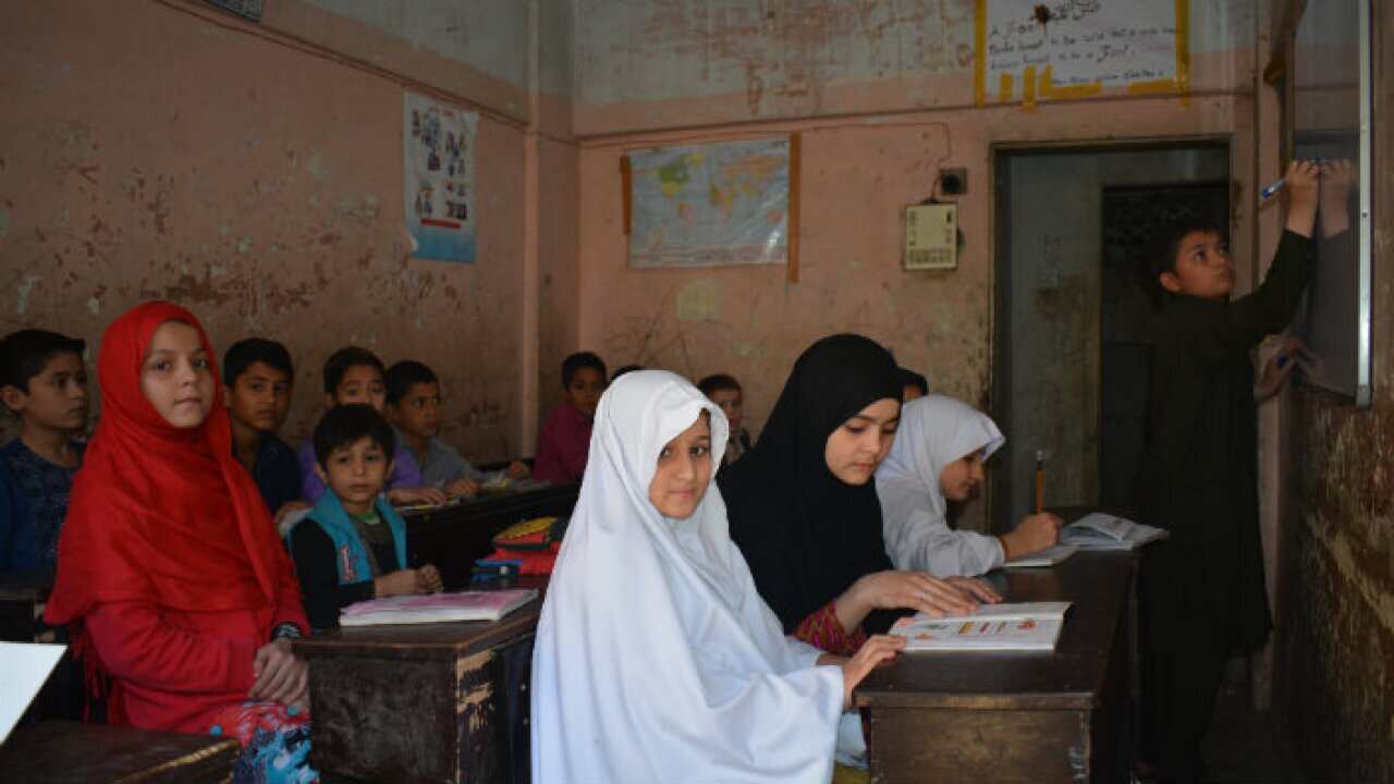Afghan refugees studying in a classroom in Karachi Pakistan