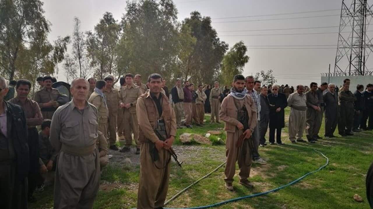 At cemetery, burying assassinated member of KDPI