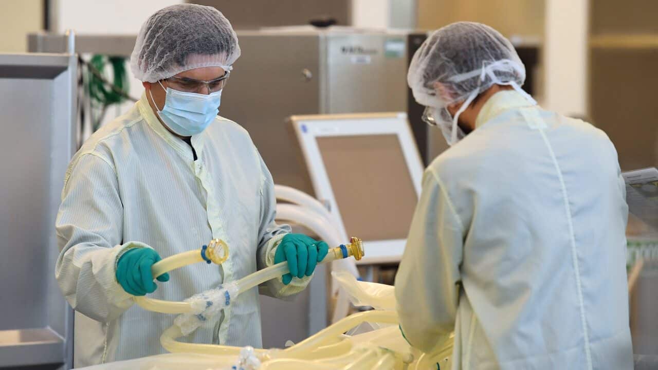 Scientists are seen at work inside of the CSL Biotech facility in Melbourne, Monday, September 7, 2020.