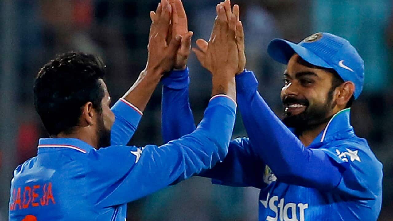 India’s Ravindra Jadeja (L) and Virat Kohli