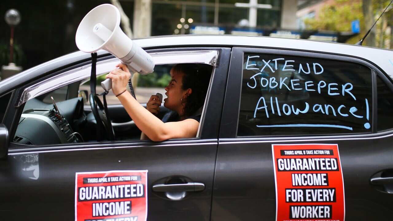 A car convoy of trade unionists and community activists drive through the Sydney CBD