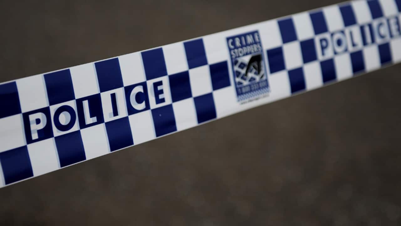 Police tape restricts access to a street in Sydney