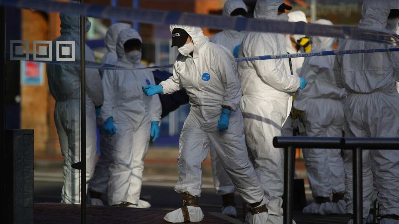 Forensic officers work near Forbury Gardens, in Reading town centre
