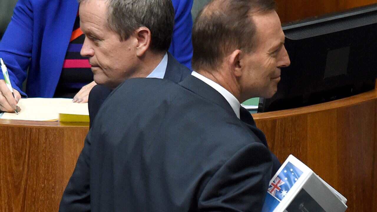 PM Tony Abbott and Opposition Leader Bill Shorten cross paths