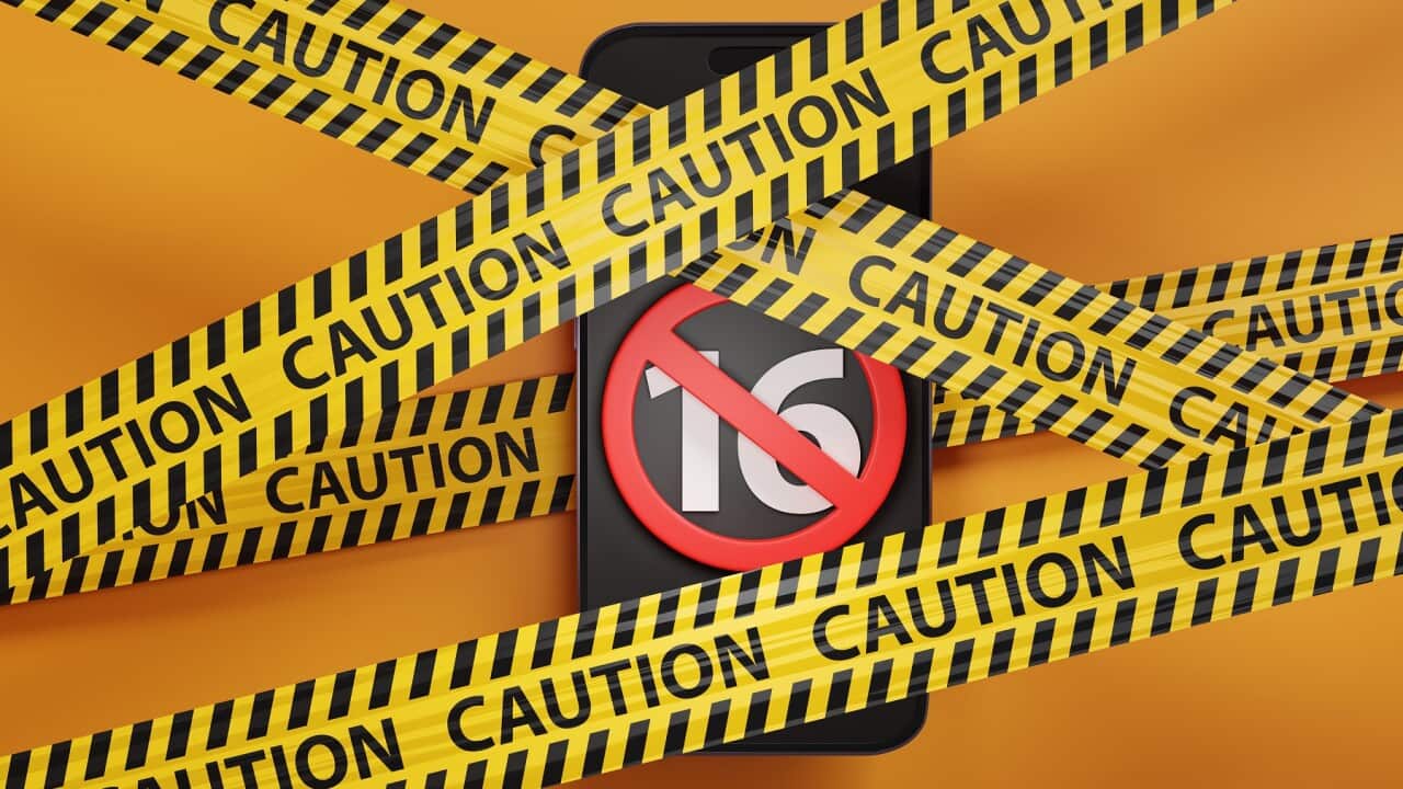 Mobile phone showing the number 16 and a red forbidden sign trapped between barrier tapes on yellow background. Illustration of the British consideration of banning sale of smartphones to under 16s
