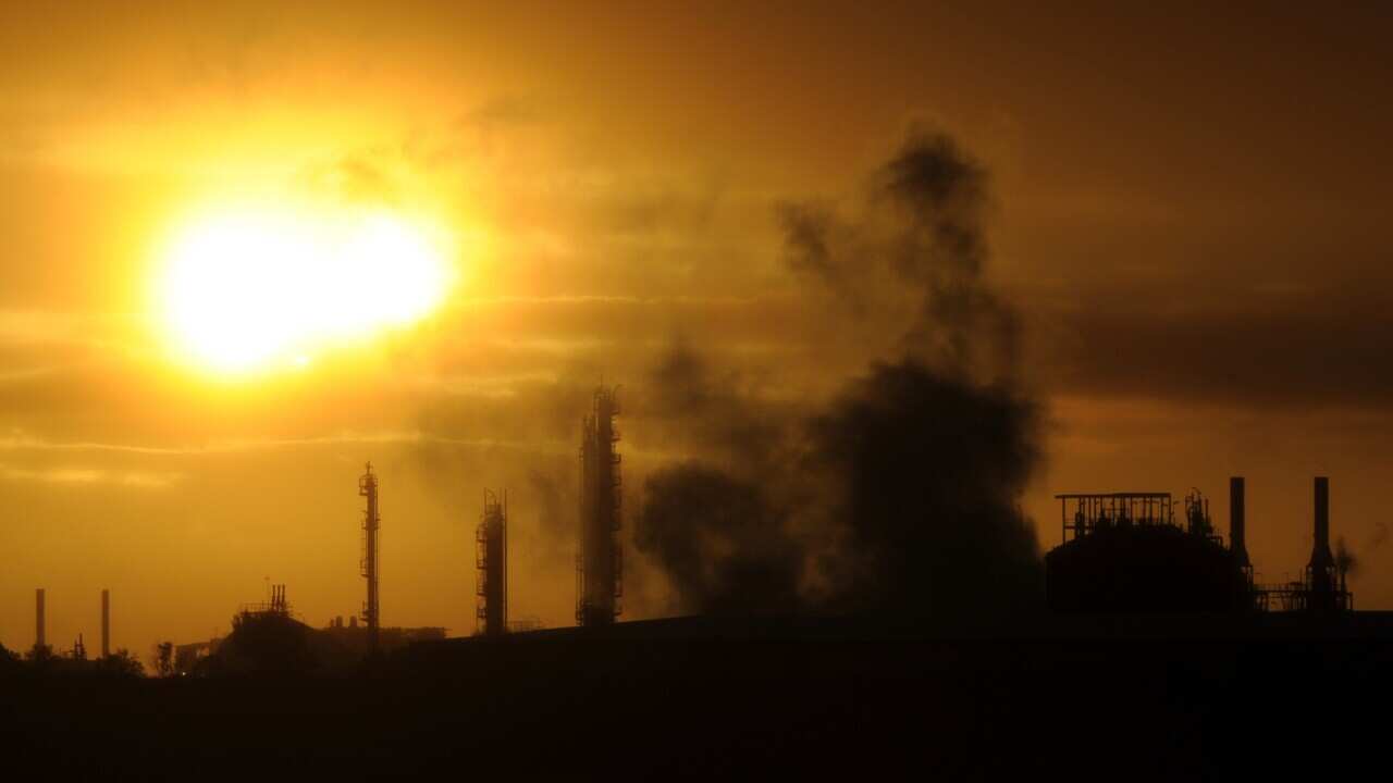 Steam and other emissions rise from an industrial plant in Melbourne, Tuesday, April 29, 2014. The Abbott government's pledge to remove the carbon tax will be tested when the new Senate is formed after July 1. (AAP Image/Julian Smith) NO ARCHIVING
