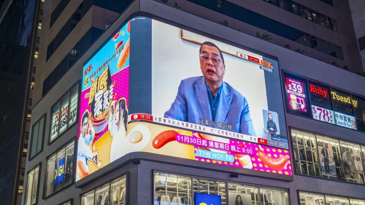 A large neon LED screen showing Hong Kong tycoon Jimmy Lai, who has been found guilty under the national security law, Hong Kong, China.