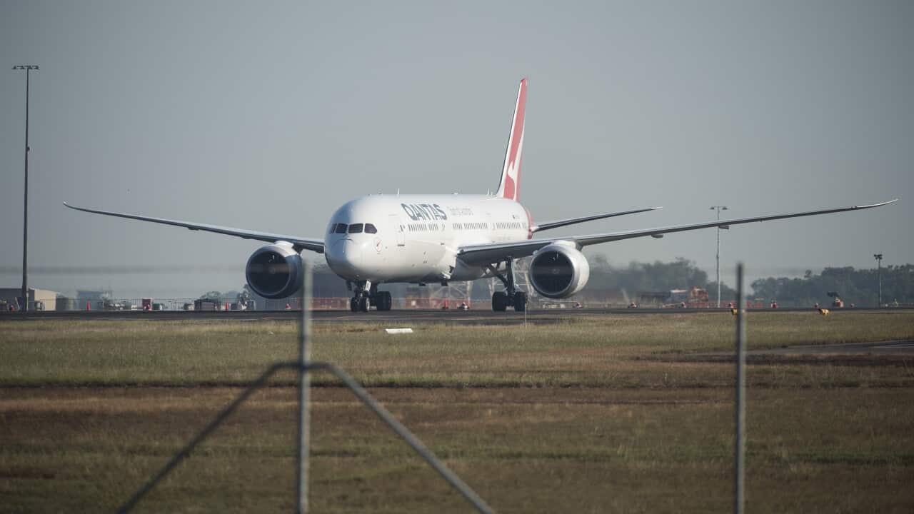 The Qantas repatriation flight from India is seen taxiing at RAAF Darwin in Darwin on Saturday, 15 May.