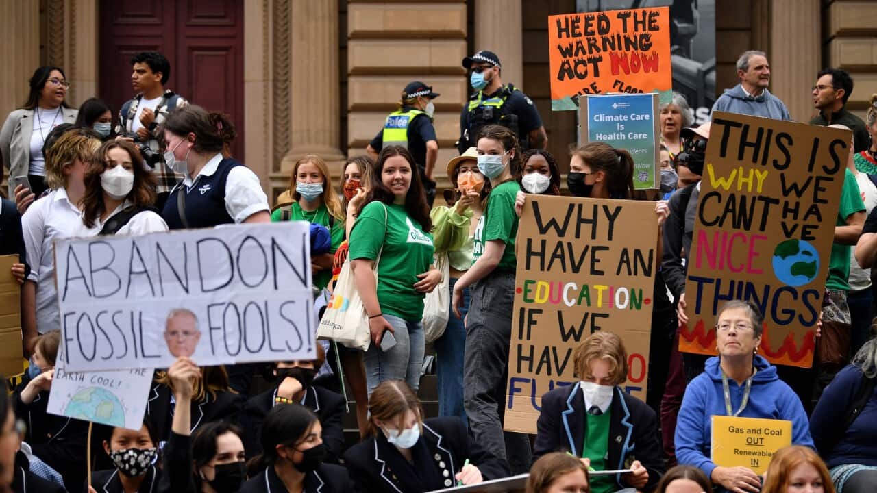 Students hold placards during a Climate School Strike protest in Melbourne.
