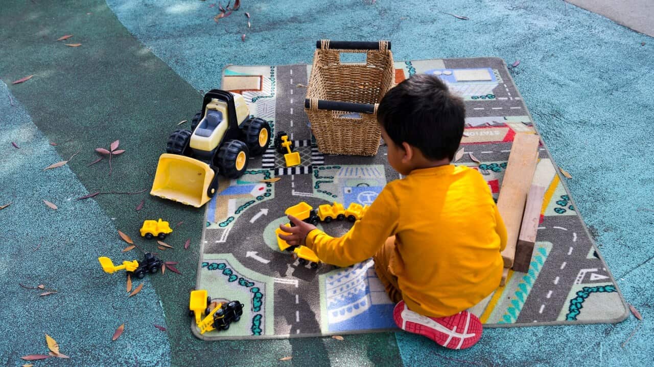 A child plays with toys at a childcare centre in Canberra (AAP)