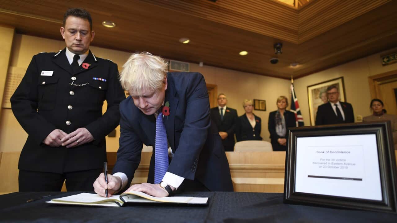 Boris Johnson signs a book of condolence during a visit to Thurrock Council Offices