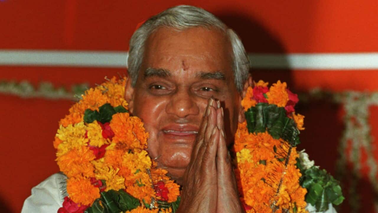 Indian Prime Minister Atal Bihari Vajpayee greets supporters after he was elected as the leader of the party by the members of Bharatiya Janata Party in New Delhi Sunday, October 10, 1999.