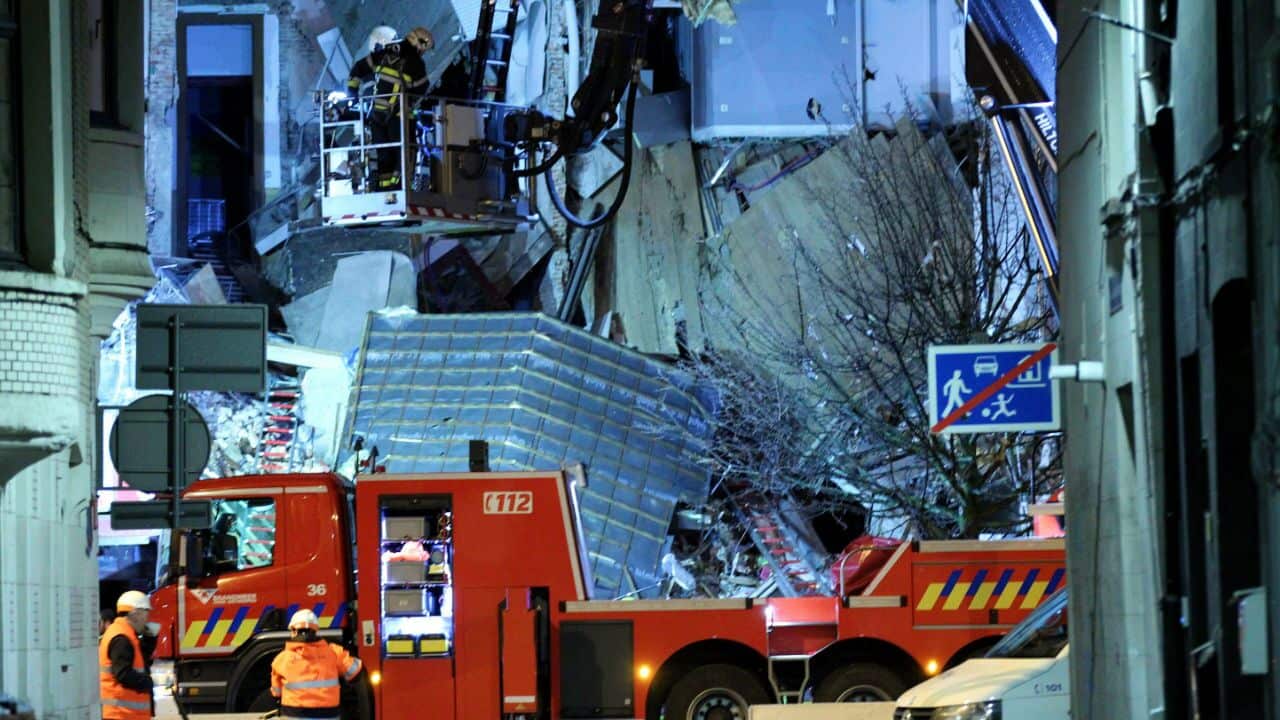 Firefighters and police officers arrive at the scene in Antwerp.