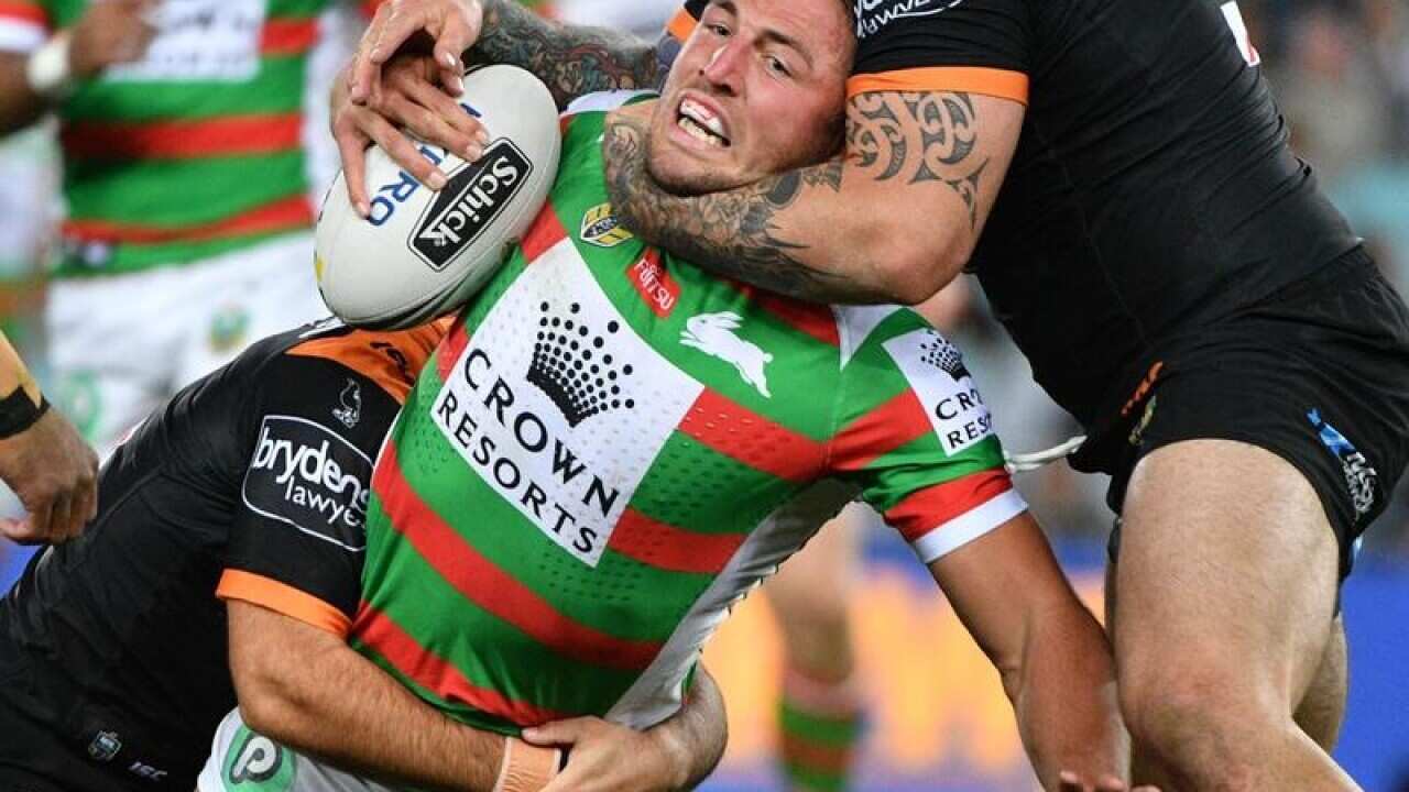 The Rabbitohs' Sam Burgess is tackled.