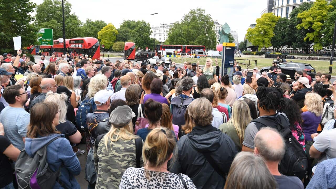 People attend a protest against the wearing of masks during the coronavirus outbreak, in Hyde Park, London