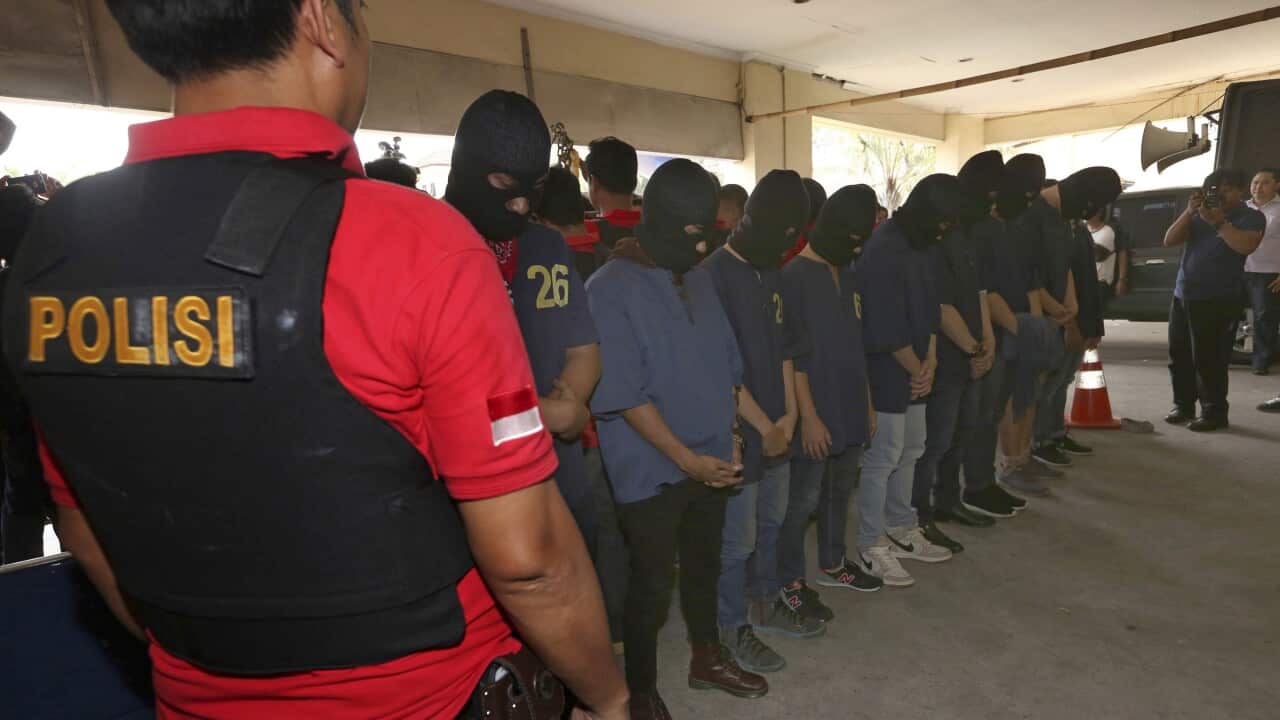(File Image) Police escort men arrested in a similar raid on a sauna at North Jakarta police headquarters in Jakarta on May 22, 2017.