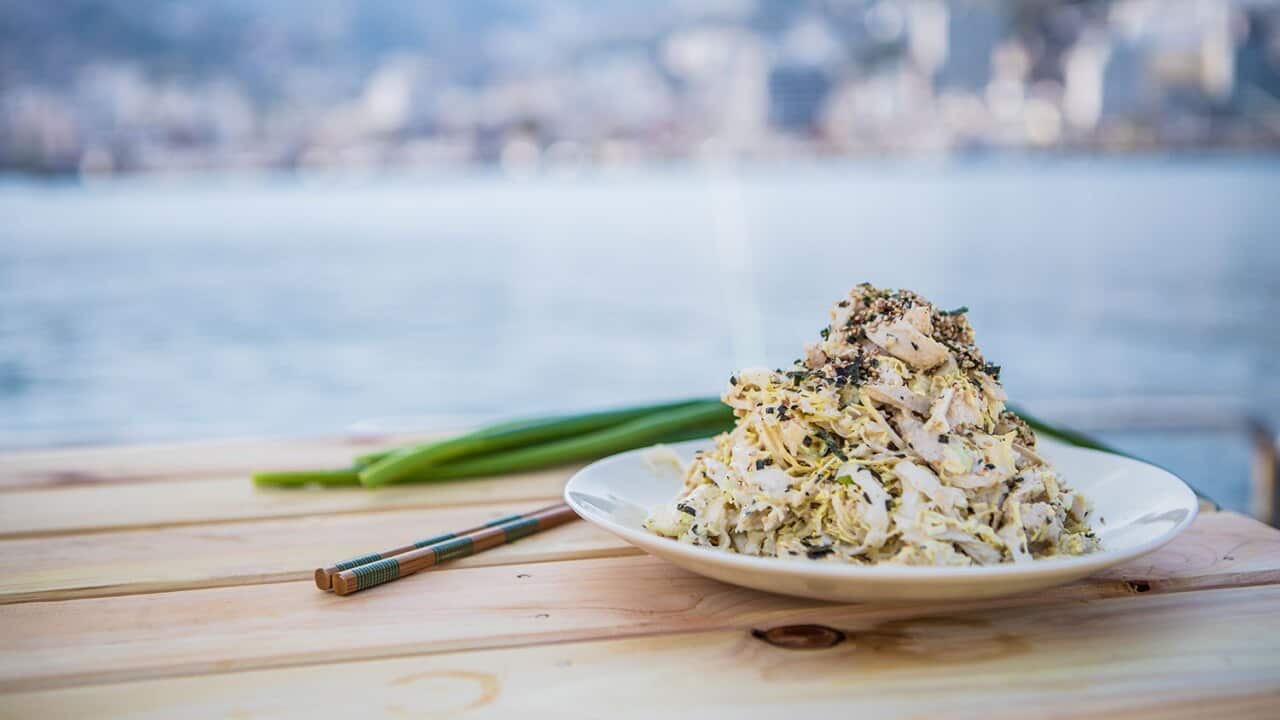Shredded chicken and cabbage salad with sesame dressing