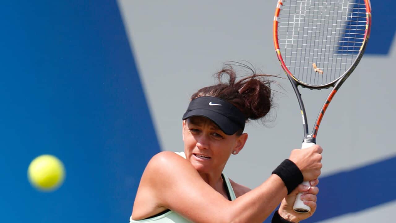 Casey Dellacqua of Australia returns the ball