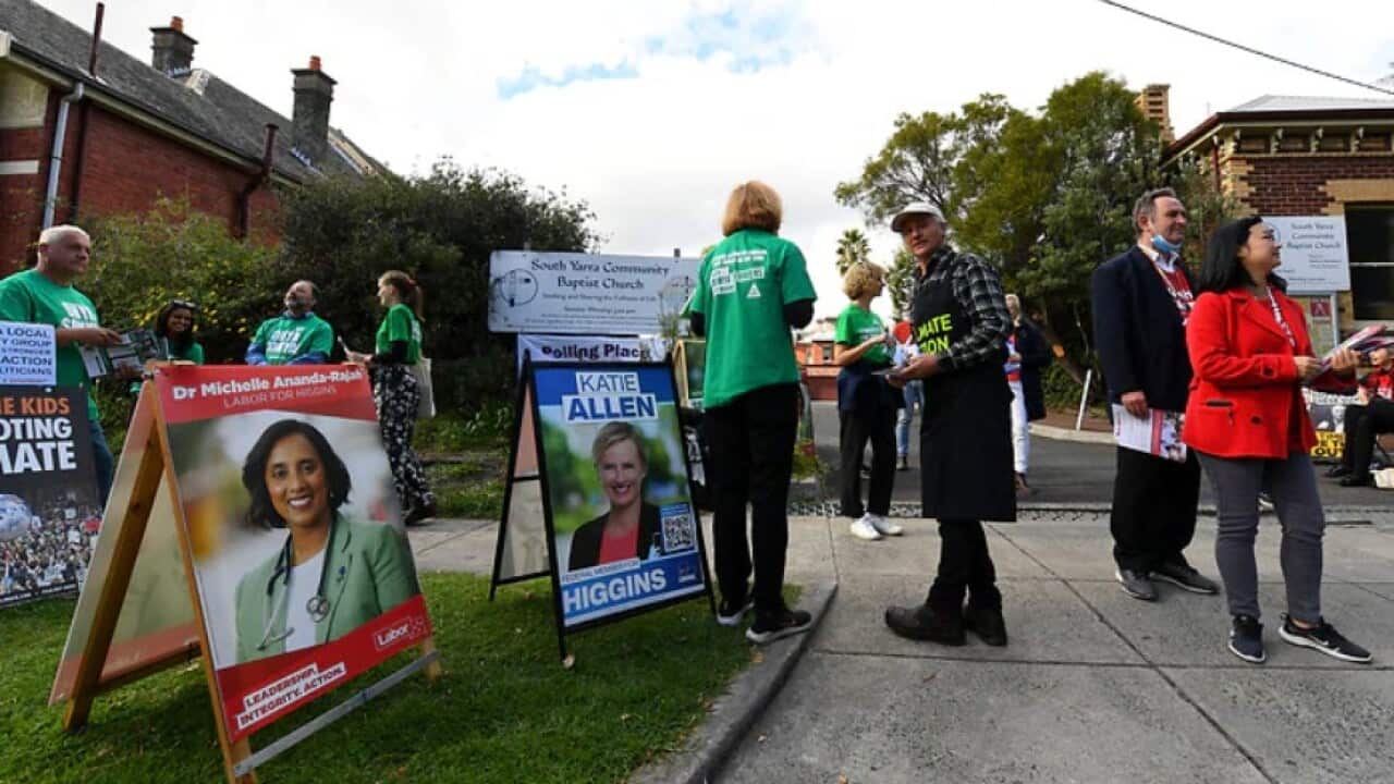 Party Volunteers are seen outside an early voting centre at the South Yarra Community Baptist Church in Melbourne.