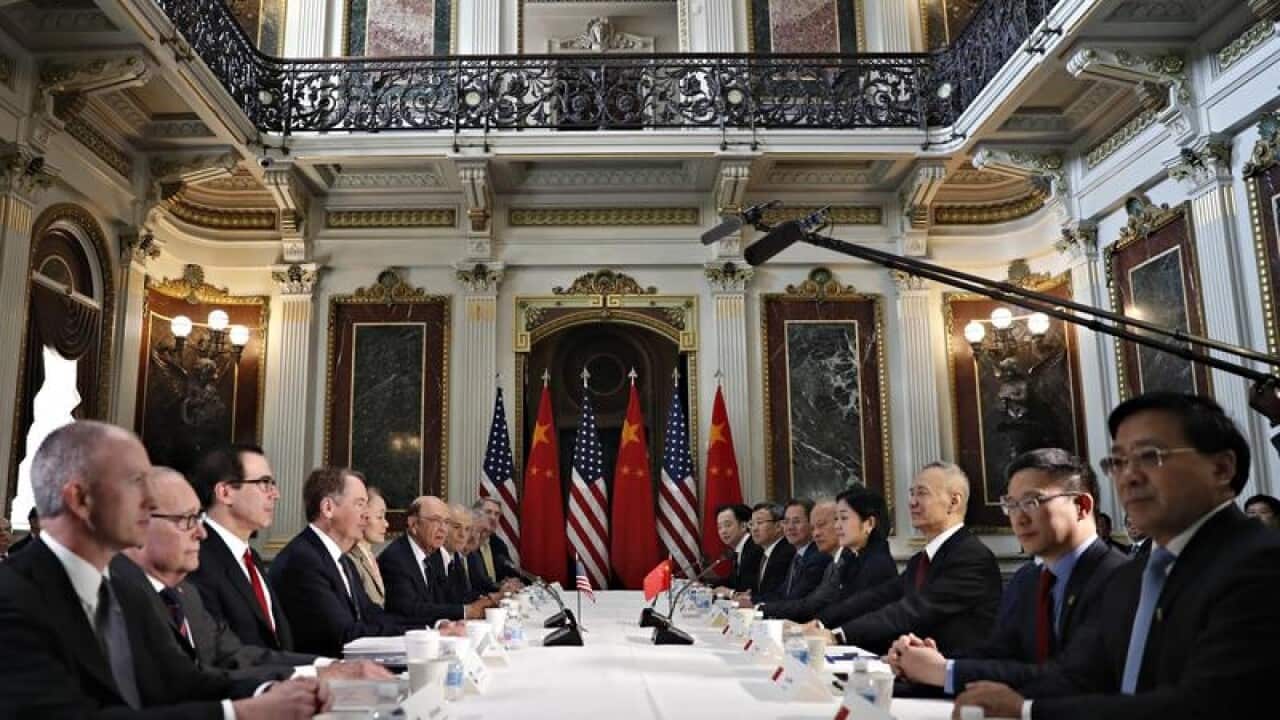 A file image of the US and Chinese delegations holding trade talks